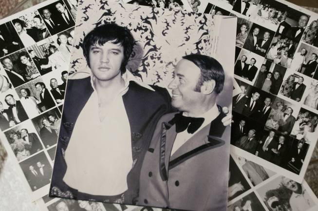 Long-time Las Vegas resident, Emilio Muscelli, shows off a photograph of him posing with Elvis Presley, Monday Jan. 9, 2012. Emilio worked as Vegas' most beloved maitre'd of the Hilton, and the International before that, and befriended many important people in the "who's who" of Vegas, Hollywood, and the world.